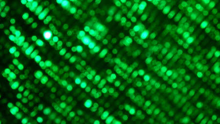 A closeup shot of green lights under the bokeh effectの写真素材