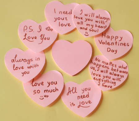 Pink Hearts with lovely romantic writings on yellow background