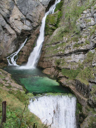 A beautiful view of big rocks and a waterfall in Triglav National park of Sloveniaの写真素材
