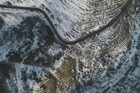 Beautiful snowy hills shot with a droneの写真素材