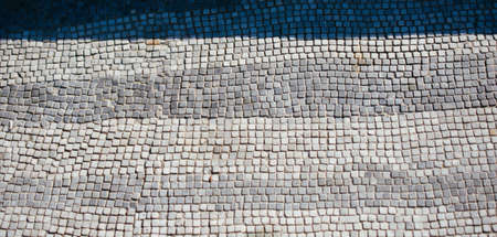 The ceramic square-shaped floor with gray  and blue colours