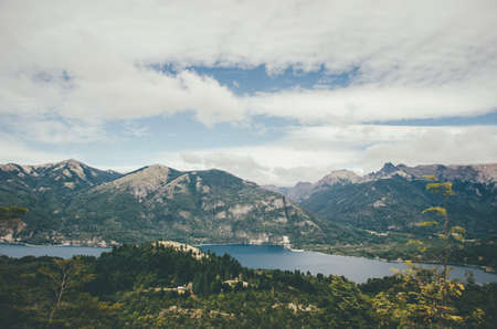 A beautiful natural landscape with amazing sky and a river shot from a hillの写真素材