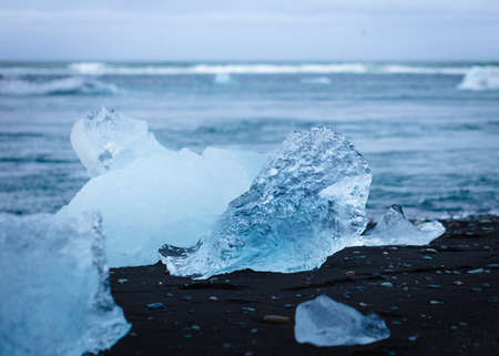 A piece of ice on the beach during winterの写真素材