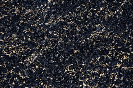 A background of a black wall with interesting textures - great for a cool wallpaper