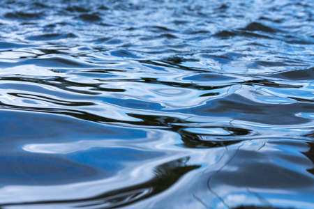 A closeup shot of beautiful sea waves at sunlightの写真素材
