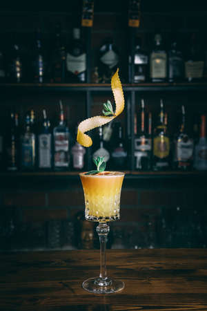 Delicious yellow colored cocktail in a classic glassの写真素材