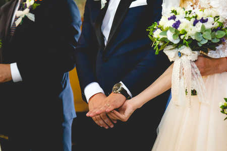 A closeup shot of a bride and groom during a wedding ceremonyの写真素材