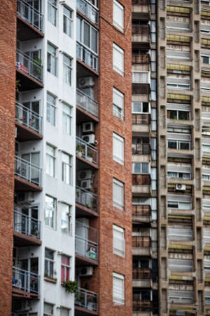 A vertical shot of tall apartment buildings in a suburban cityの写真素材