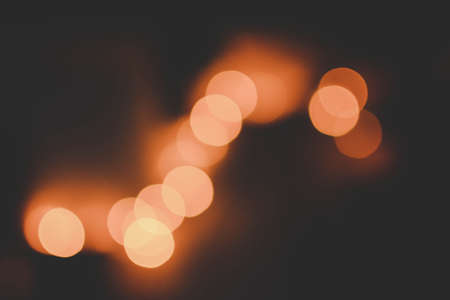 A beautiful shot of orange bokeh lights