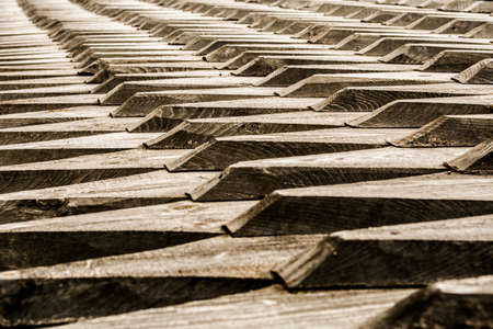 Wooden roof tiles of a stave church in Norway. Detail and close-up.の写真素材