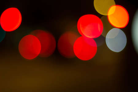 A colorful bokeh effect of city lights at night creating a beautiful abstract background