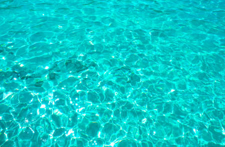 A closeup of clear water reflecting the sunlight