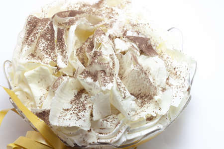 A closeup shot of cream and custard bignolata cake with cream puffs