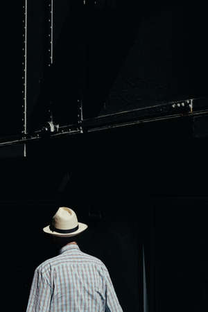 An elderly male in a hat having a little walkの写真素材