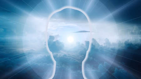 An illustration of a male head figure with clouds on the backgroundの写真素材