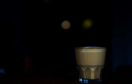 A cup of well-made latte with art on foam