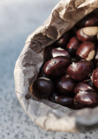 A closeup shot of chestnuts in a carton bagの写真素材