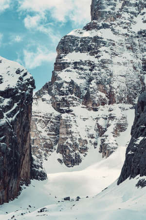 A beautiful shot of a snow-covered high mountainの写真素材