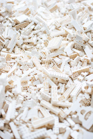 A vertical selective focus shot of all white toy brick building blocksの写真素材