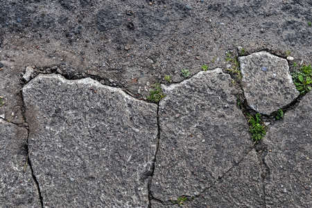 A closeup surface texture of an old small road in northern Europe