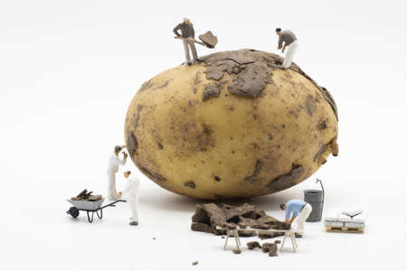 A unique scale model of miniature characters working together to reach a common goal