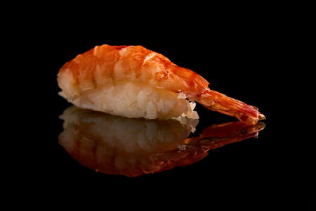 Isolated sushi closeup with reflection and black backgroundの写真素材