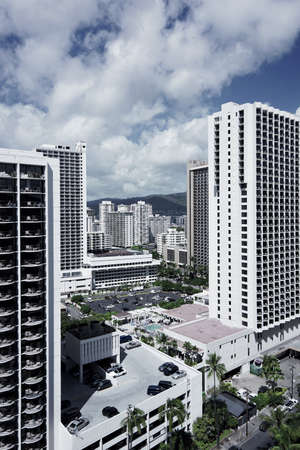 A beautiful aerial shot of the city with tall buildings and beautiful cloudy skyの写真素材