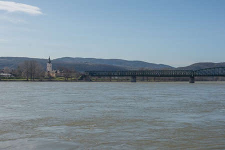 The mountains in front of the water under the blue sky