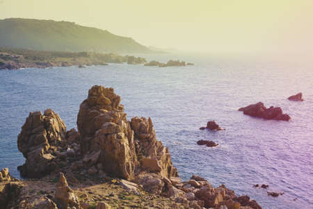 A beautiful seascape and some rocks in Spiaggia Li Cossi Costa in Italy