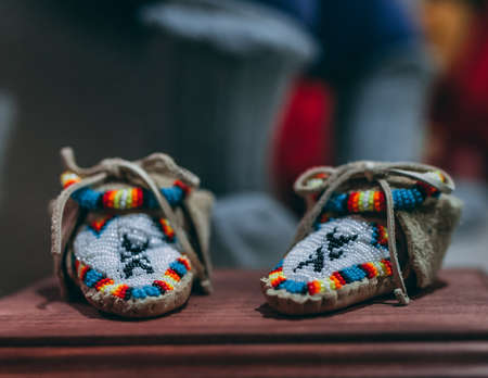 A closeup shot of knotted woolen footwear made with adornments
