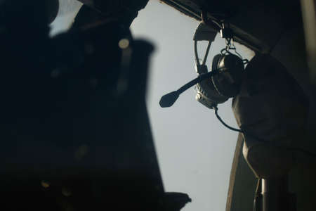 A closeup selective focus shot of headphones of a helicopter pilot