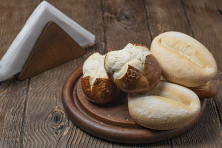 A closeup shot of a fresh bread assortment on the tableの写真素材