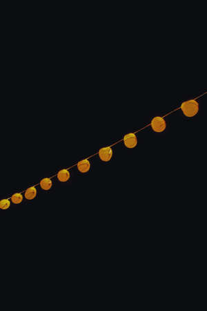 A low angle shot of turned on paper lanterns at night time