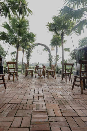 A beautiful vertical shot of a decorated open-air wedding receptionの写真素材