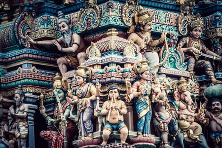 A closeup shot of Hindu ornaments and a group of Deity statues of a Hindu temple in Singaporeの写真素材