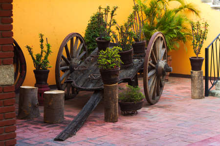 An old decorative wooden cart with big wheels