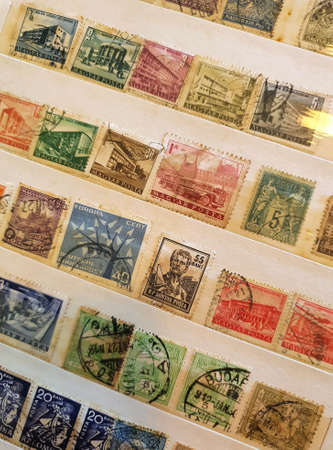 SOVATA, ROMANIA - Jul 02, 2020: A page from a philatelic catalog with many old stamps