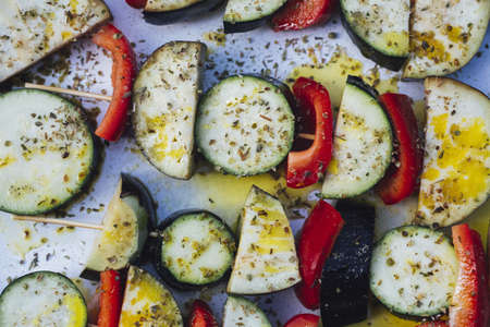 A high angle shot of delicious raw vegetables on a white trayの写真素材
