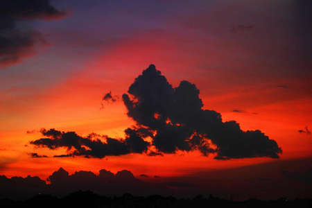 A beautiful silhouette shot of clouds in the sky during sunset