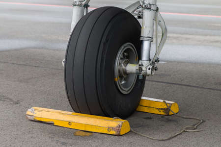 A close up shot of the wheel of an aircraft