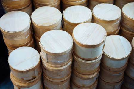 A closeup shot of a pile of steam basketsの写真素材