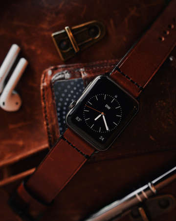 A closeup shot of a modern cool black digital watch with a brown leather strapの写真素材