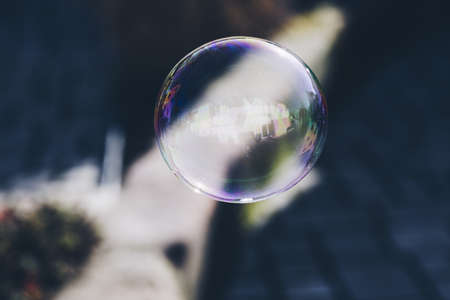 A closeup shot of a bubble with a blurred background