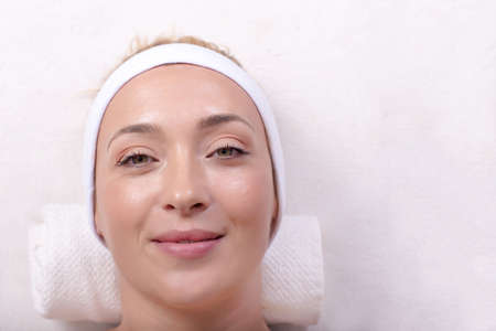 A young female taking care of her face in the beauty salon