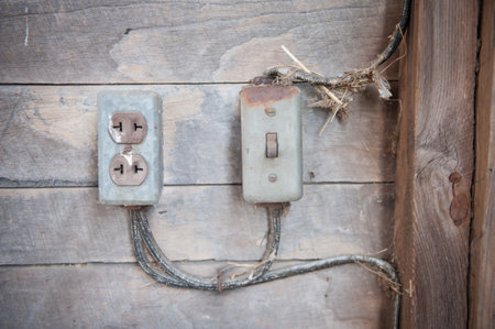 A closeup shot of electricity sockets and a switch of an old barn in the countryside of Pennsylvaniaの写真素材