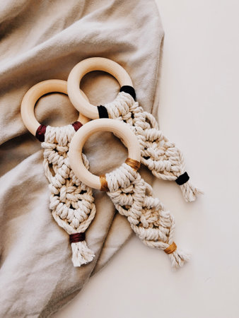 A high angle shot of crochets on a beige textile