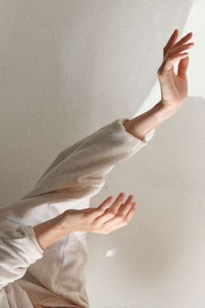 The calming movement of female's thin soft handsの写真素材