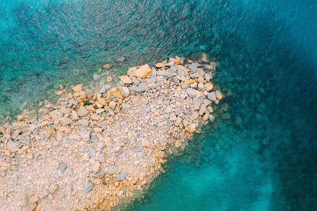 A top view of the sandy beach captured during the daytime