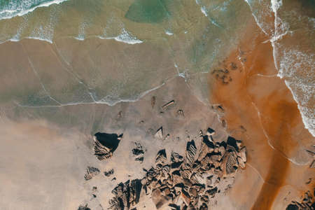 A top view of the sandy beach captured during the daytimeの写真素材