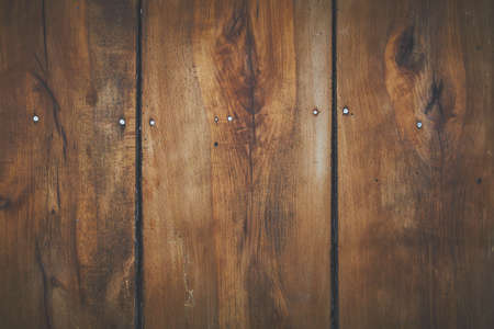 A brown wooden board of planks for background or wallpaper